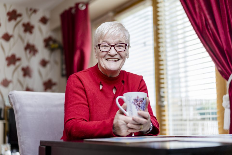 Older woman with cup of tea